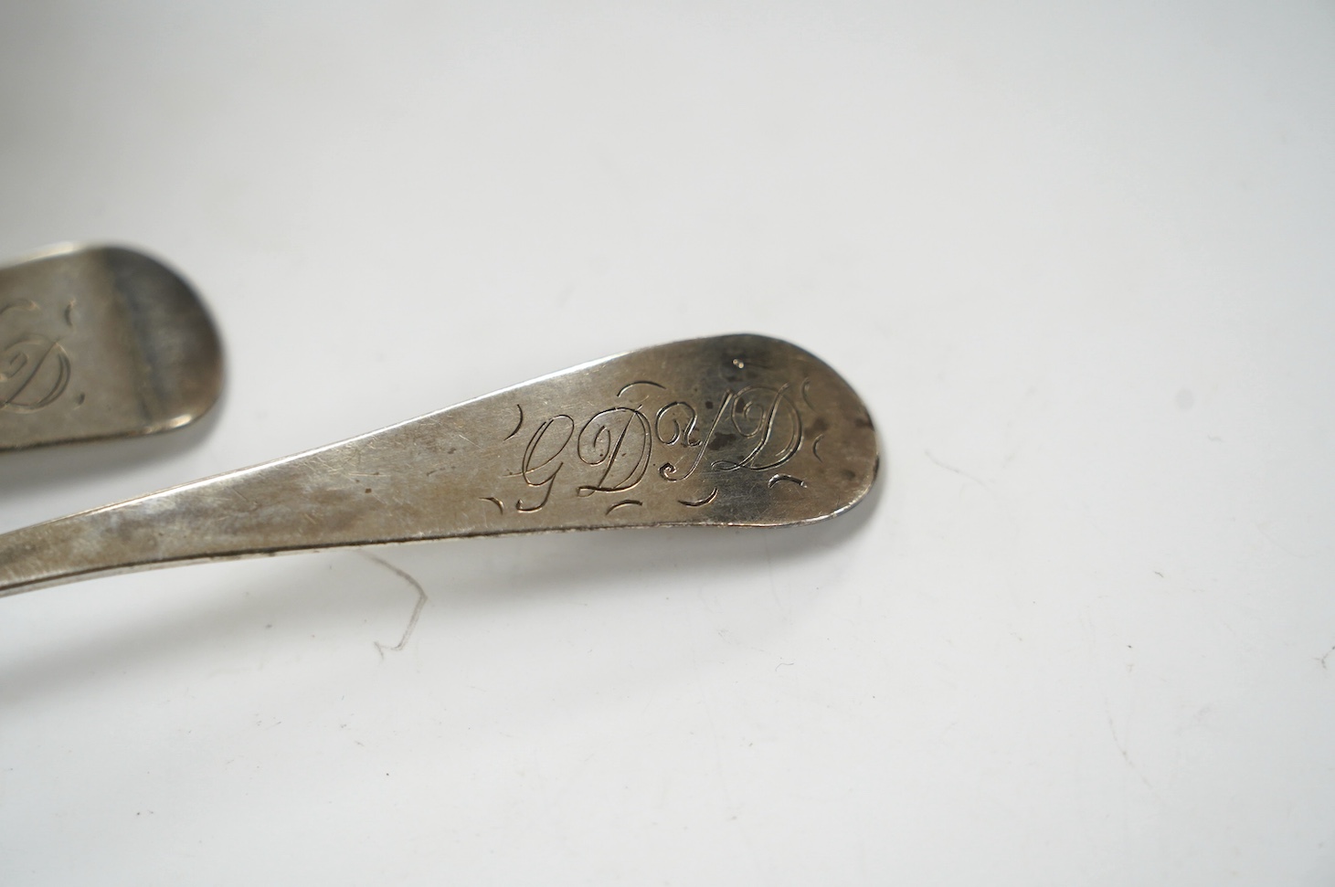 Two George III provincial silver Exeter table spoons, 22cm, two silver napkin rings and two silver mounted glass toilet jars. Condition - poor to fair